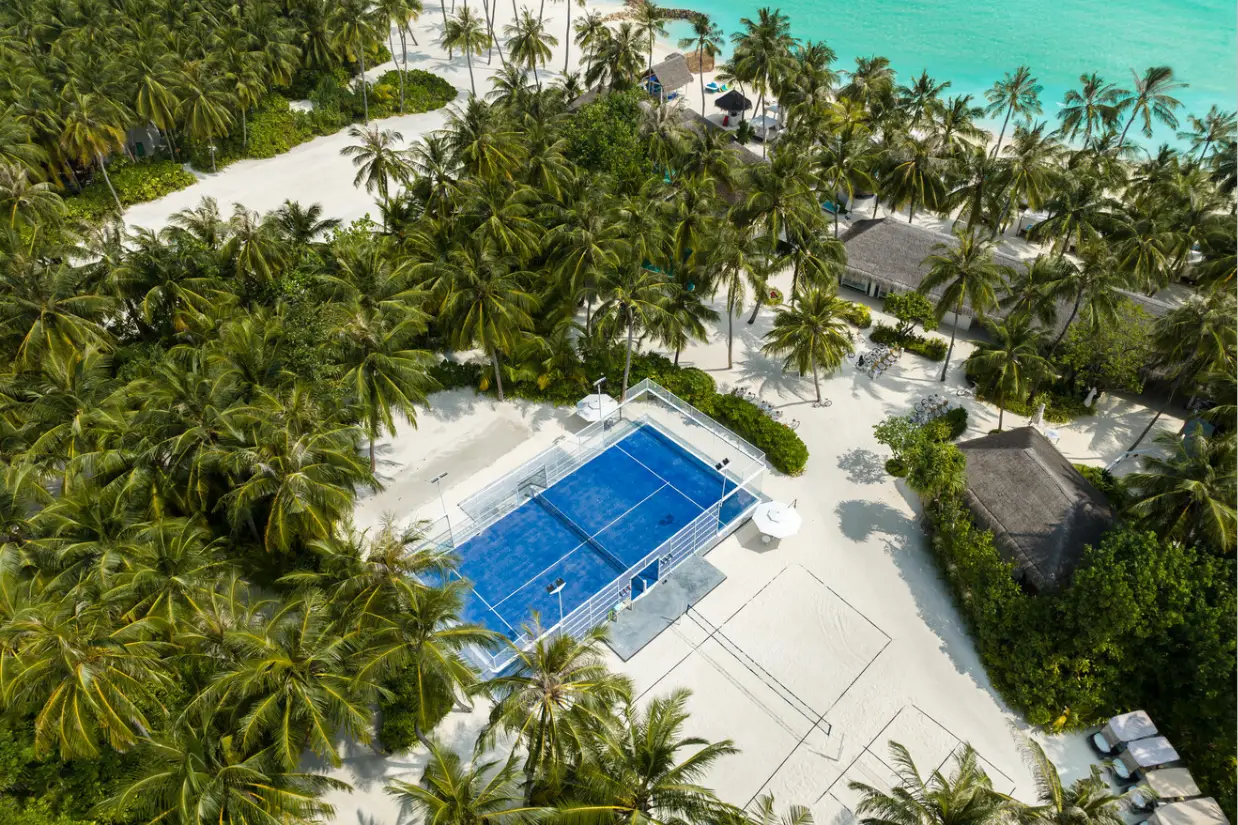 Luxury padel court at a high-end resort surrounded by dramatic scenery